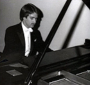 James K. McCully playing the piano